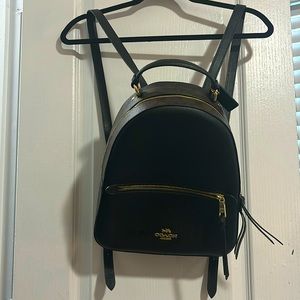 black and brown coach back pack.